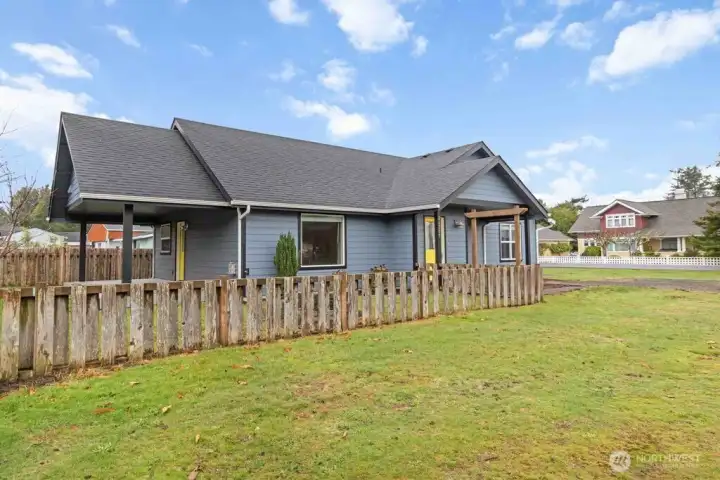 Fenced Front yard, east side of house.