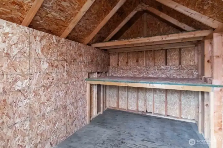 Nice work bench inside the shed. Nice work bench inside the shed.