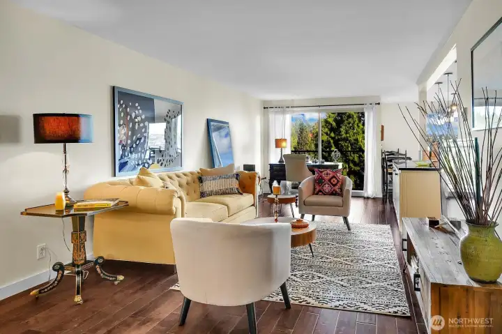 Living room open to the kitchen and dining.
