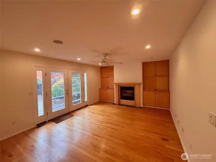 Family Room - built-in cabinets, ceiling fan, french doors to backyard patio