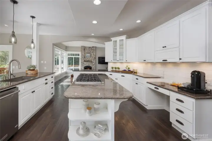 Updated chef's kitchen features dual islands, Viking 6-burner gas stove & a Sub-Zero fridge.