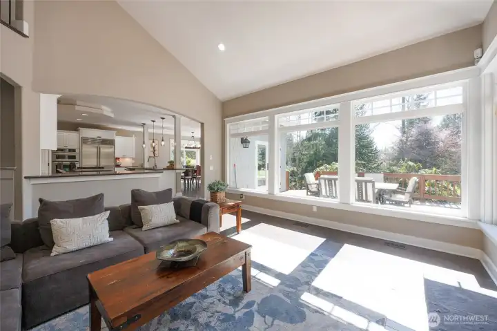 Vaulted ceilings & floor-to-ceiling windows let in natural light.