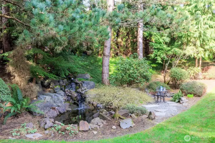 Enjoy your morning coffee next to the peaceful Koi pond located off of the MAIN floor Primary Suite.