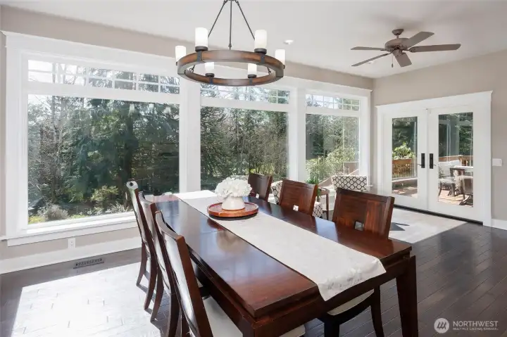 Walls of floor-to-ceiling windows in the dining area, kitchen and family room.