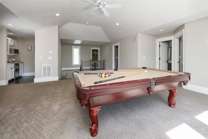 Pool table area includes a kitchenette.