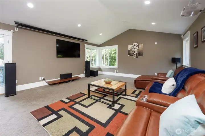 Media/recreation room with a walk-out yard.