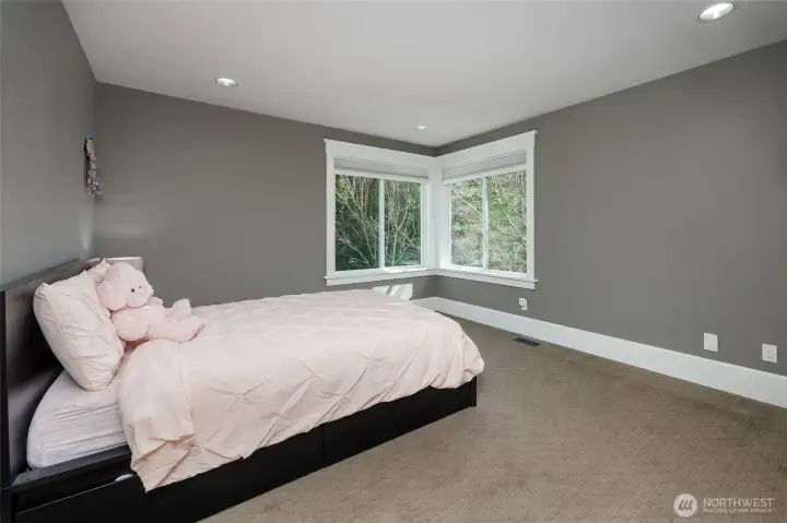 One of four spacious bedrooms with adjacent bathroom.