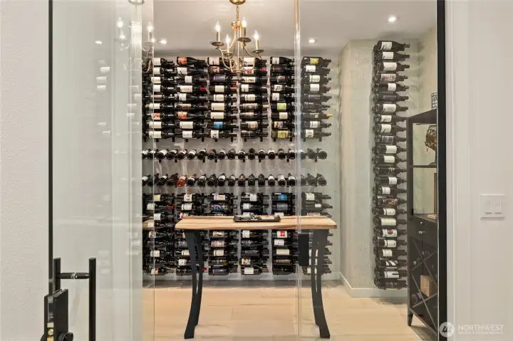 The custom 732-bottle climate-controlled wine cellar is simply a collector's dream. Fully enclosed with vapor barrier and foam insulation and WhisperKool dedicated ductless mini split system. Wine bottles not included.