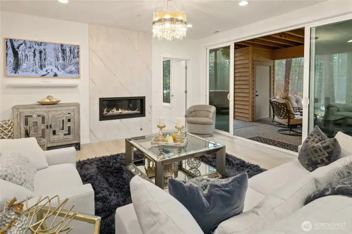 Lower level recreation room with fireplace, Samsung Frame TV and Sonos Sound System with wall mounted soundbar, two ceiling rear speakers.