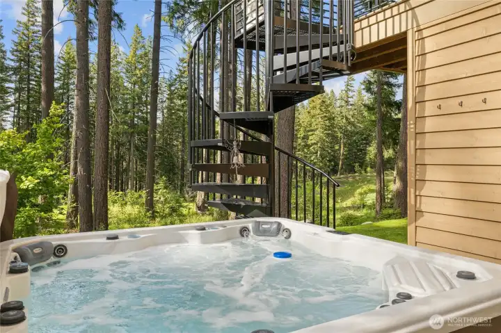 Look at this outdoor oasis! The Beachcraft Myrtle Beach hot tub has a foot massage dome, bluetooth speakers & wi-fi enabled. The spiral staircase leads to the main level covered deck.