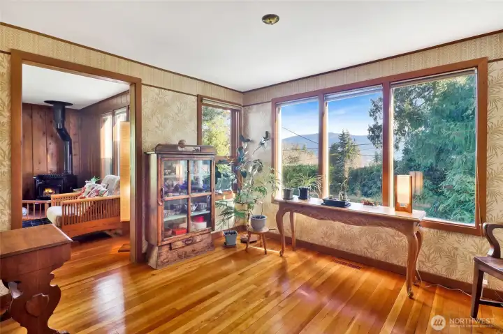 Step inside the front entry with warm fir floors with partial Lake Whatcom Views and looking into the living room.