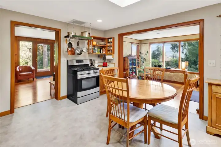 Kitchen looking to the front entry and living room with easy access to the deck for barbecuing or outside dining.