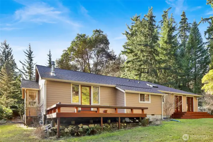 Large deck with seating bench outside the living room, and another private deck off the primary bedroom. The roof replaced in 2023!