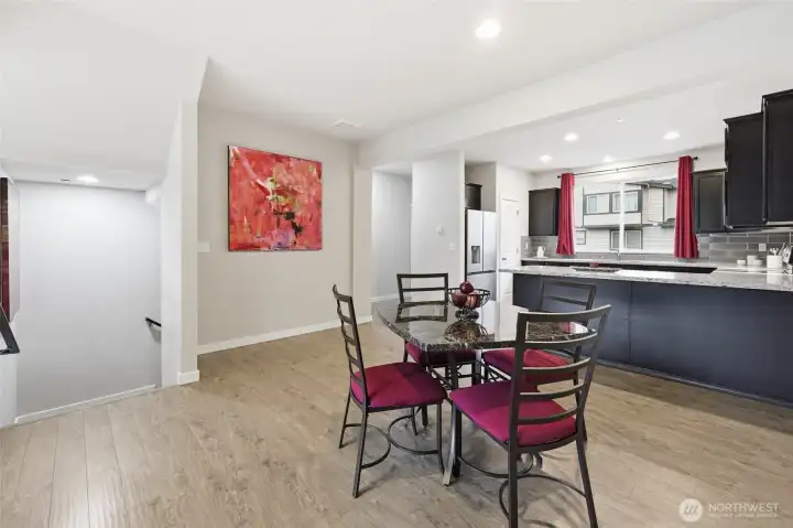 Kitchen flows to spacious dining area.