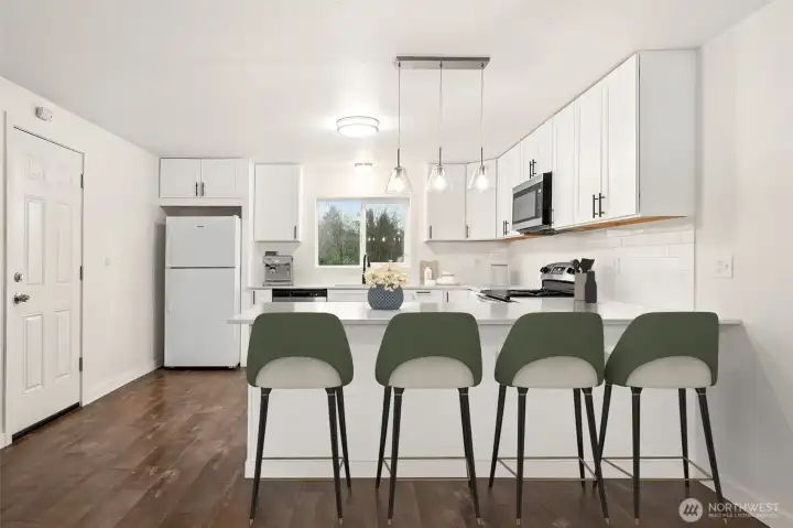 Kitchen with breakfast bar *virtually staged*