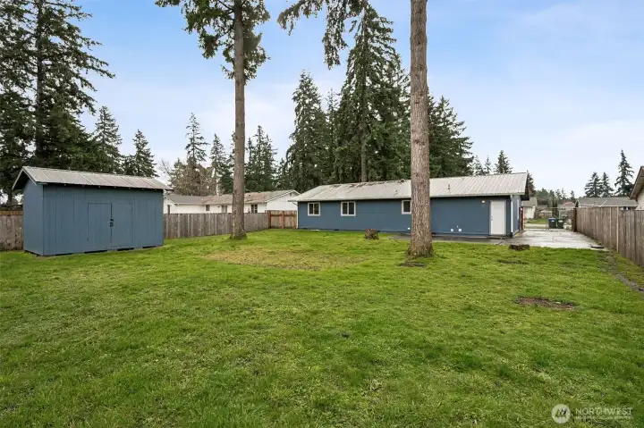 Fully Fenced Backyard with Patio, RV Parking, and Storage Shed