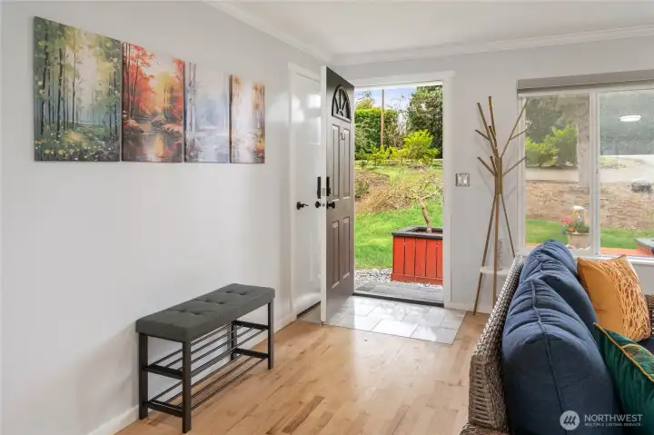 Entry with space for art and a bench. Coat/storage closet just inside.