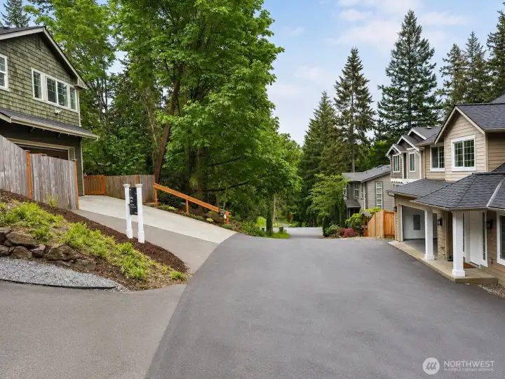 A recently established easement significantly enhanced access to the property, creating a more convenient and functional approach to the home with improved everyday usability. The newly paved driveway and expanded access area provide easier navigation, smoother entry, additional clarity of use, and a welcoming arrival experience that complements the home’s private natural setting.