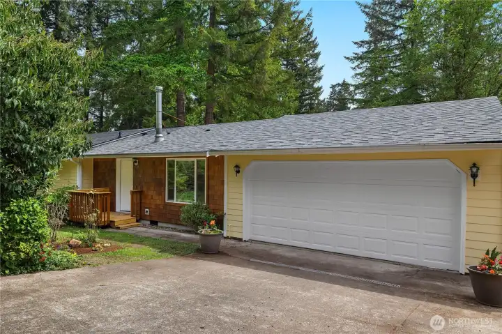 Welcome Home to this clean Evergreen Shores rambler with fresh exterior paint, mature landscaping, and an oversized two-car garage.
