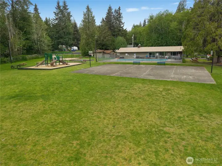 Enjoy Evergreen Shores community park with play areas, open lawn, pool, and recreation space.