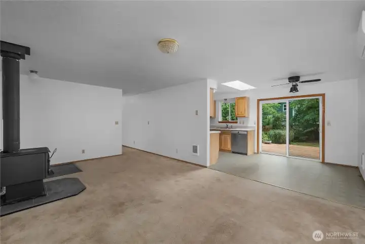 Open living and dining flow with backyard deck access and an easy rambler layout.
