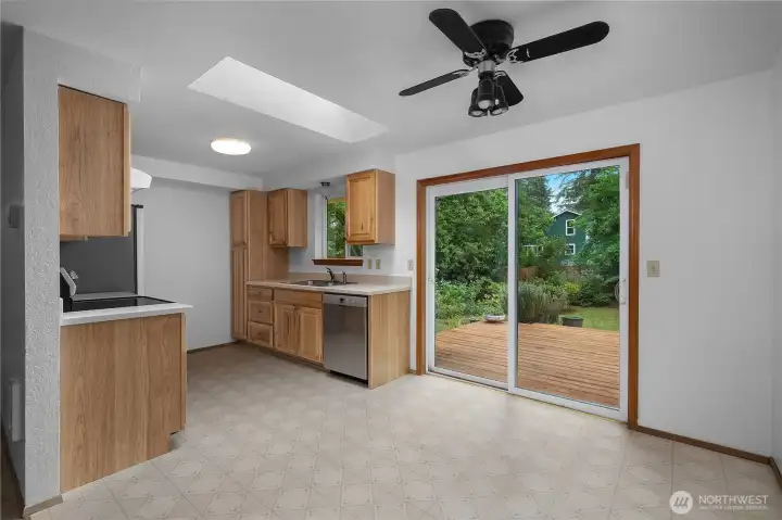 Dining area opens directly to the backyard deck for easy indoor/outdoor living.