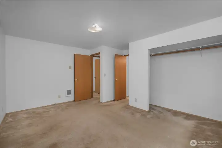 PBR - Spacious bedroom with large closet area, neutral finishes, and flexible furniture placement.