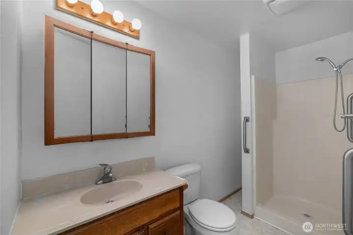 Primary BR - Bathroom with walk-in shower, vanity storage, and practical everyday layout.