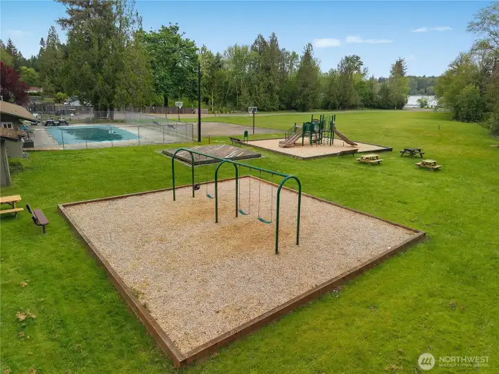 Community playground, sport court, pool, and picnic areas offer year-round neighborhood fun.