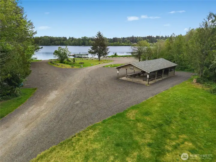 Black Lake access with cabana, picnic area, beach, dock, and room to relax by the water.