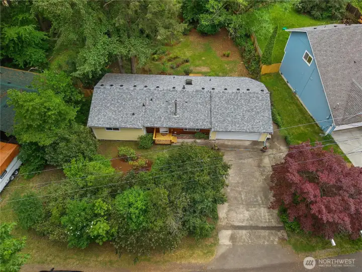 Nearly 1/4 acre lot with mature landscaping, backyard privacy, and easy one-level living.