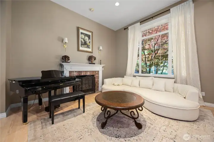 Separate living room with tall ceilings, updated finishes, and comfortable secondary gathering space filled with natural light.