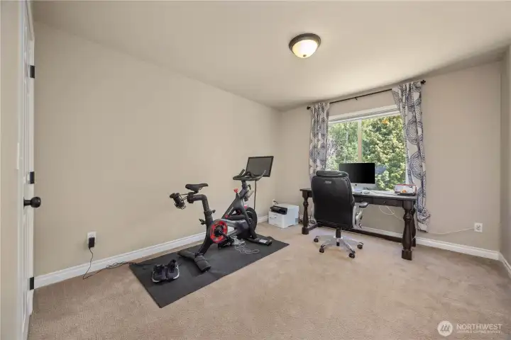 Bright bedroom with closet space, updated finishes, and comfortable layout for guests or an office