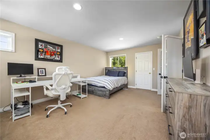 Large bonus room or sixth bedroom with flexible layout perfect for media room, office, or guest suite.