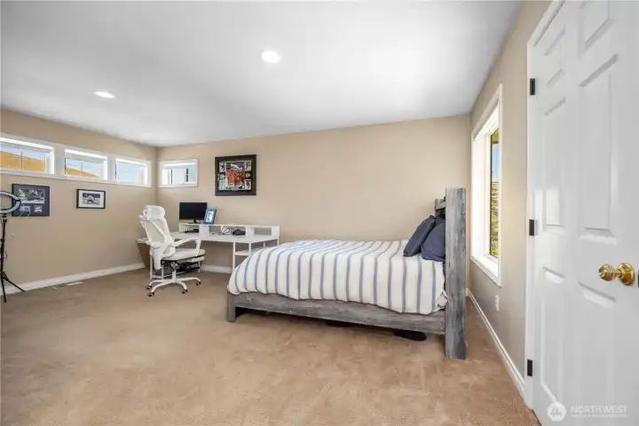Large bonus room or sixth bedroom with flexible layout perfect for media room, office, or guest suite.