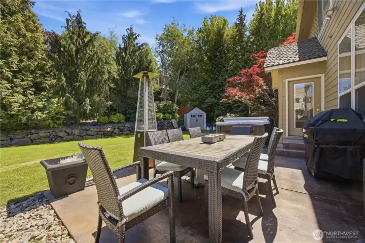 Backyard patio space perfect for BBQs, gatherings, and enjoying the beautifully maintained outdoor living area.