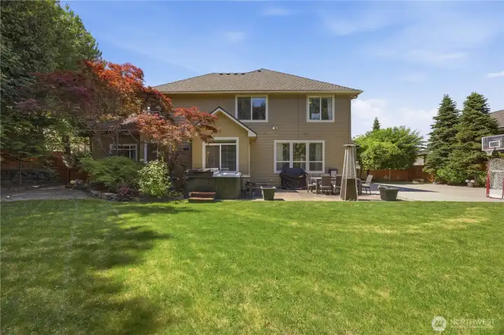 Spacious fully usable backyard with mature landscaping, entertaining areas, and room for recreation.