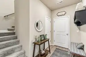 Garage entry with super large under the stairs storage/coat closet!