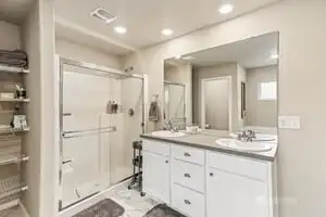 This primary suite bath allows you plenty of space for two!