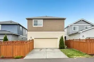 A small fenced area on the left side of your driveway.  Accessed from the side covered patio too!