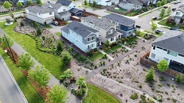 Home in the middle with nice front yard area.