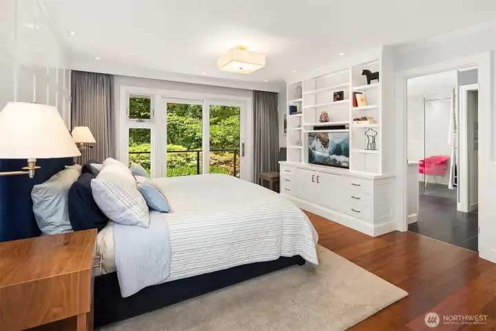 Main floor primary with slider to deck, gorgeous custom millwork and cabinetry, heated floors in bath, walk-in shower, free-standing tub and walk-in closet.