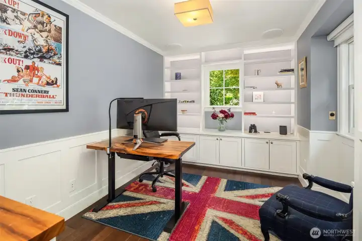 Main floor den with custom cabinetry