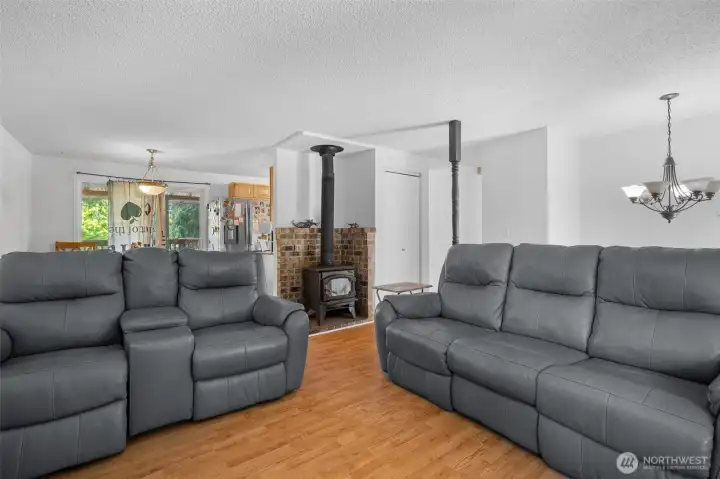 Upper-level living room with cozy wood-burning fireplace.