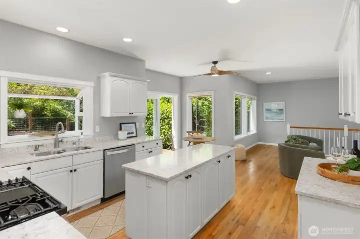 The well appointed kitchen has loads of light and looks out over the back yard. The well appointed kitchen has loads of light and looks out over the back yard.