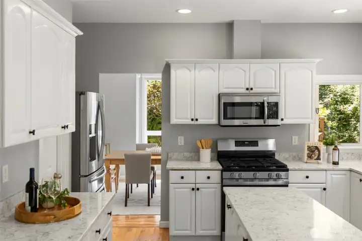 The kitchen with island, pantry on the left and extra storage. The kitchen with island, pantry on the left and extra storage.