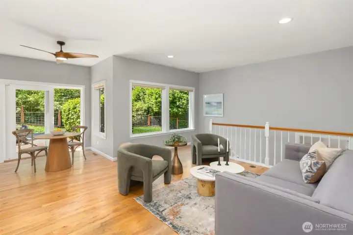 The family room space off the kitchen. The steps lead to the lower bonus space and the garage. The family room space off the kitchen. The steps lead to the lower bonus space and the garage.
