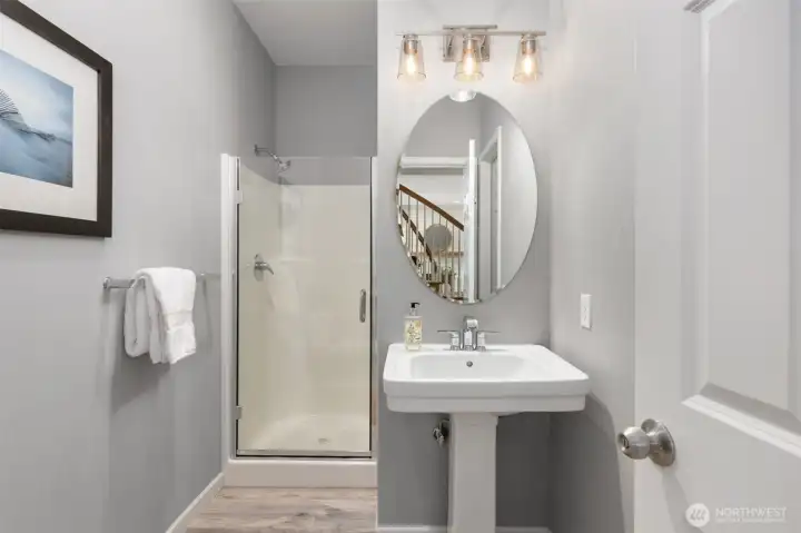 The 3/4 bath on the main floor with a door to the main floor bedroom. The 3/4 bath on the main floor with a door to the main floor bedroom.