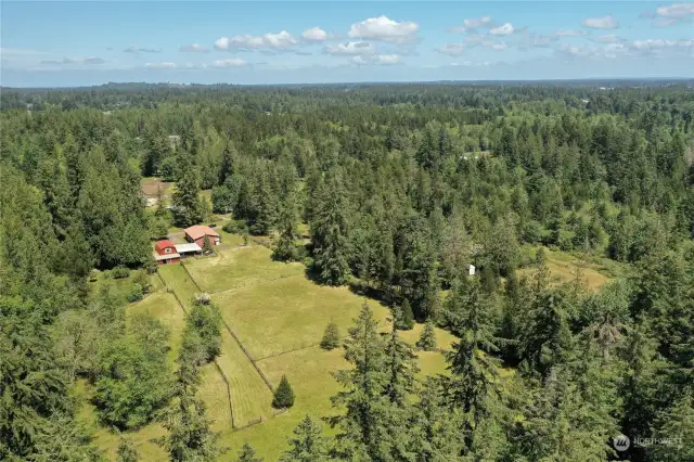 Drone shot of rear of full property from the rear, over 5 acres, barn, shop, pastures, amazing!