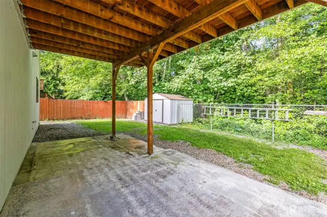 Fenced backyard. There are trails into woods